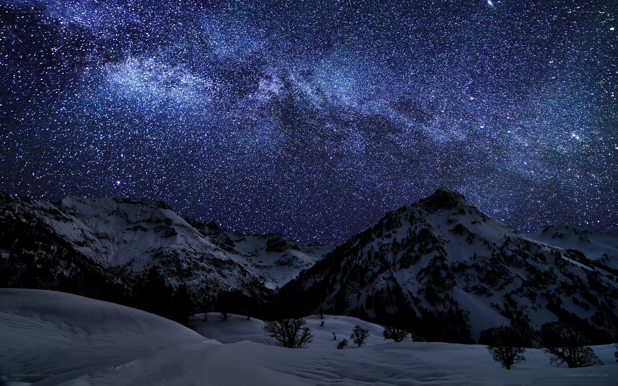 Milky Way over snowy mountains