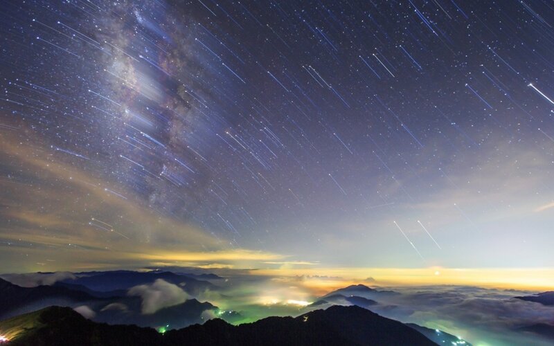 Milky Way star trails over mountains