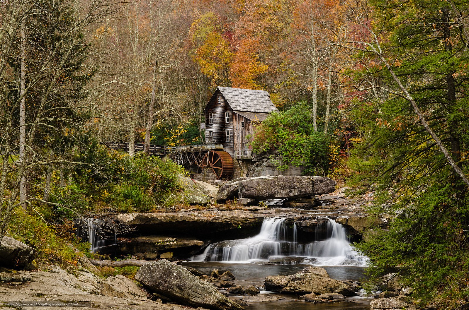 Mill by a waterfall in autumn