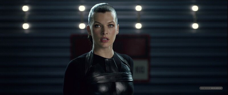 Milla Jovovich in a black suit