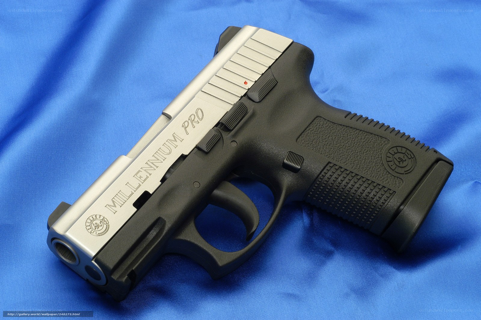 Millennium Pro pistol on blue cloth