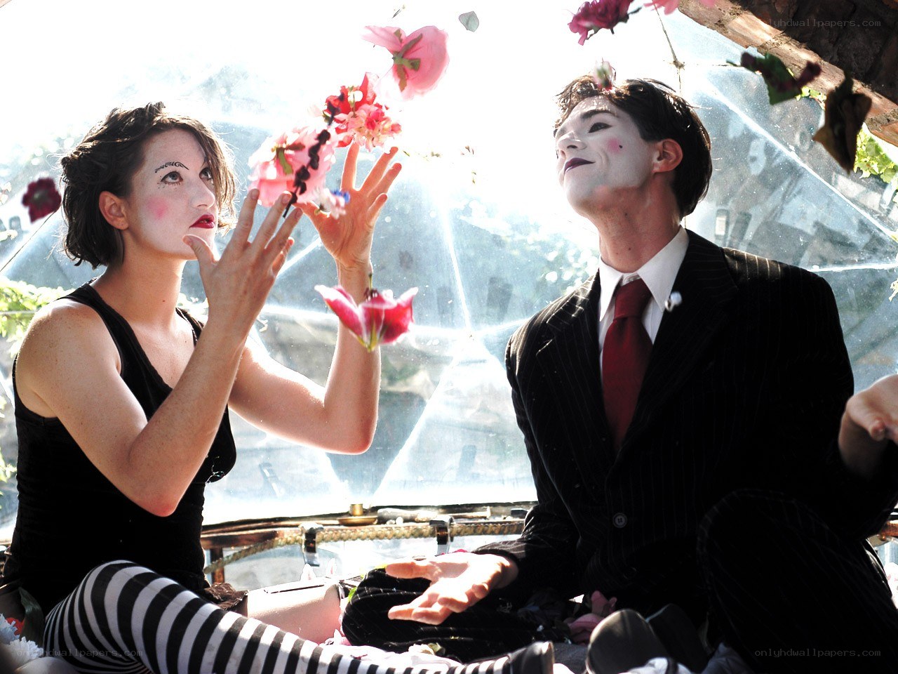 Mime performers with flowers