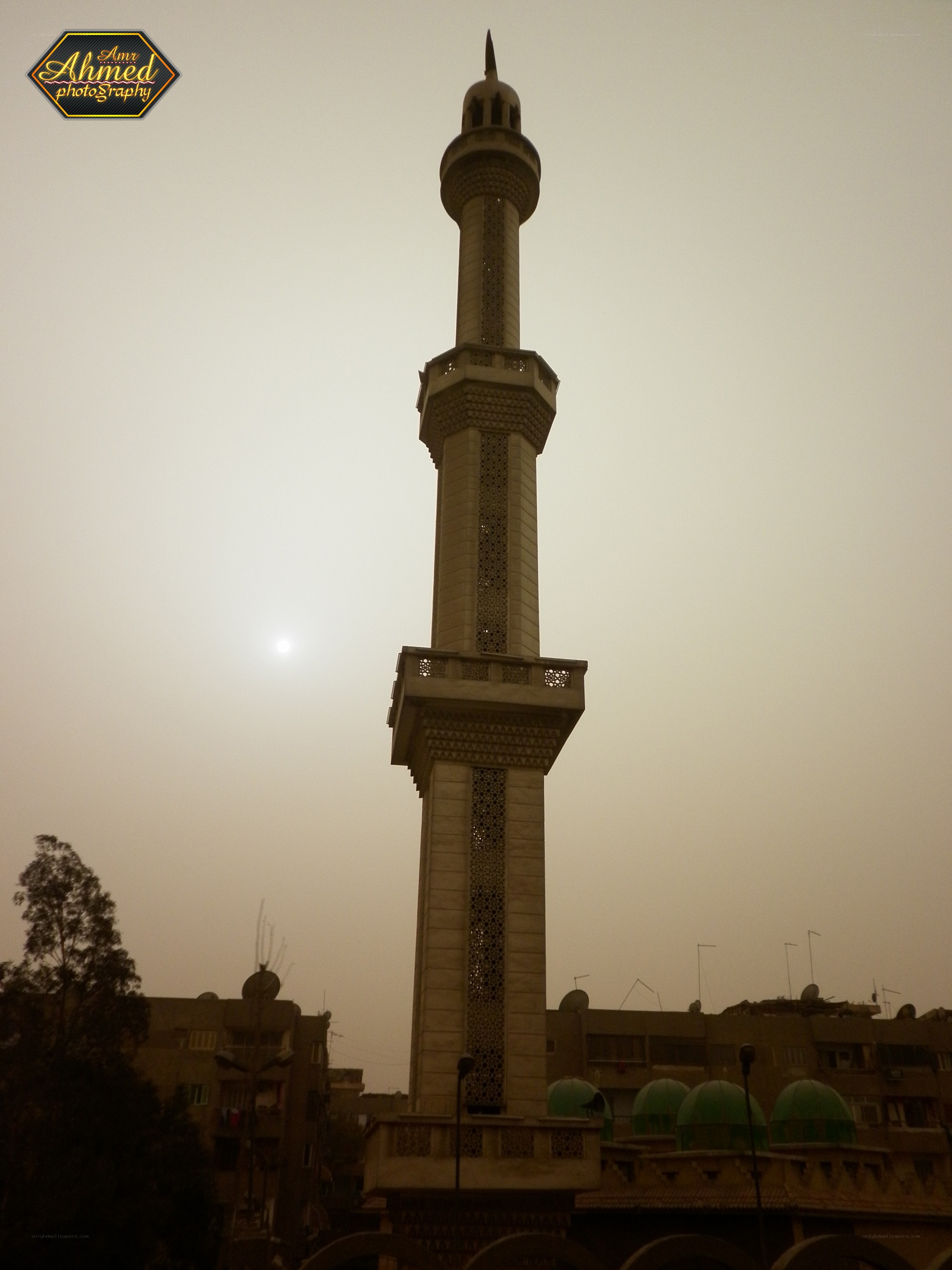 Minaret against hazy sky