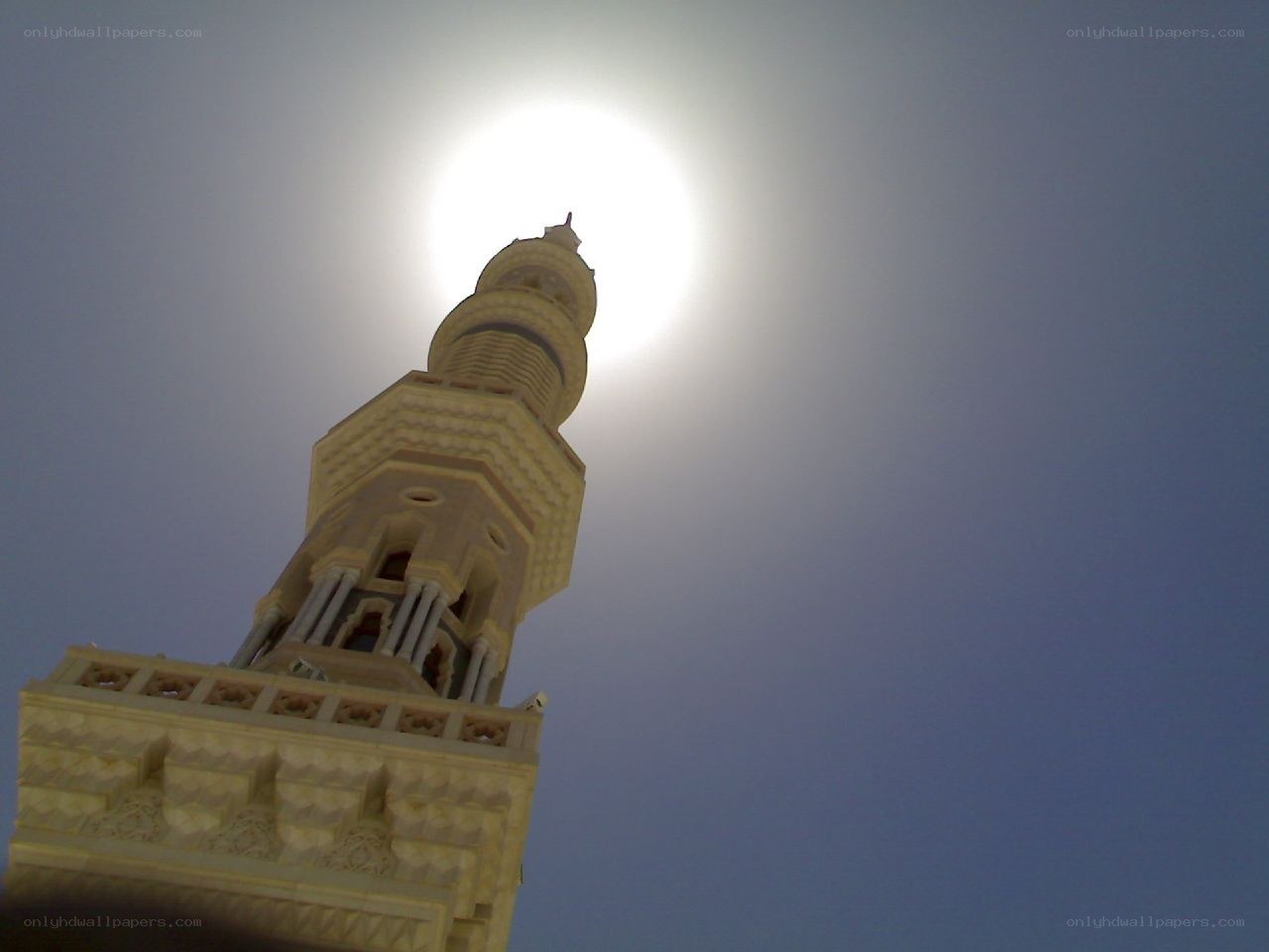 minaret against the sun