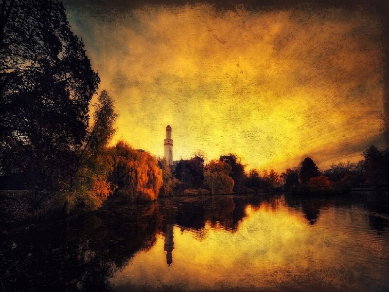 Minaret by Lake at Sunset