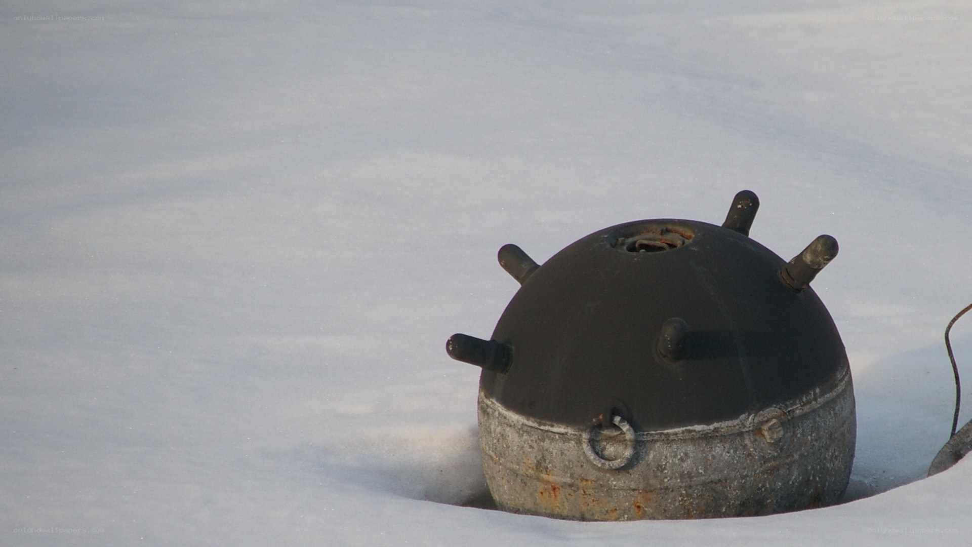 Mine in snow-covered field
