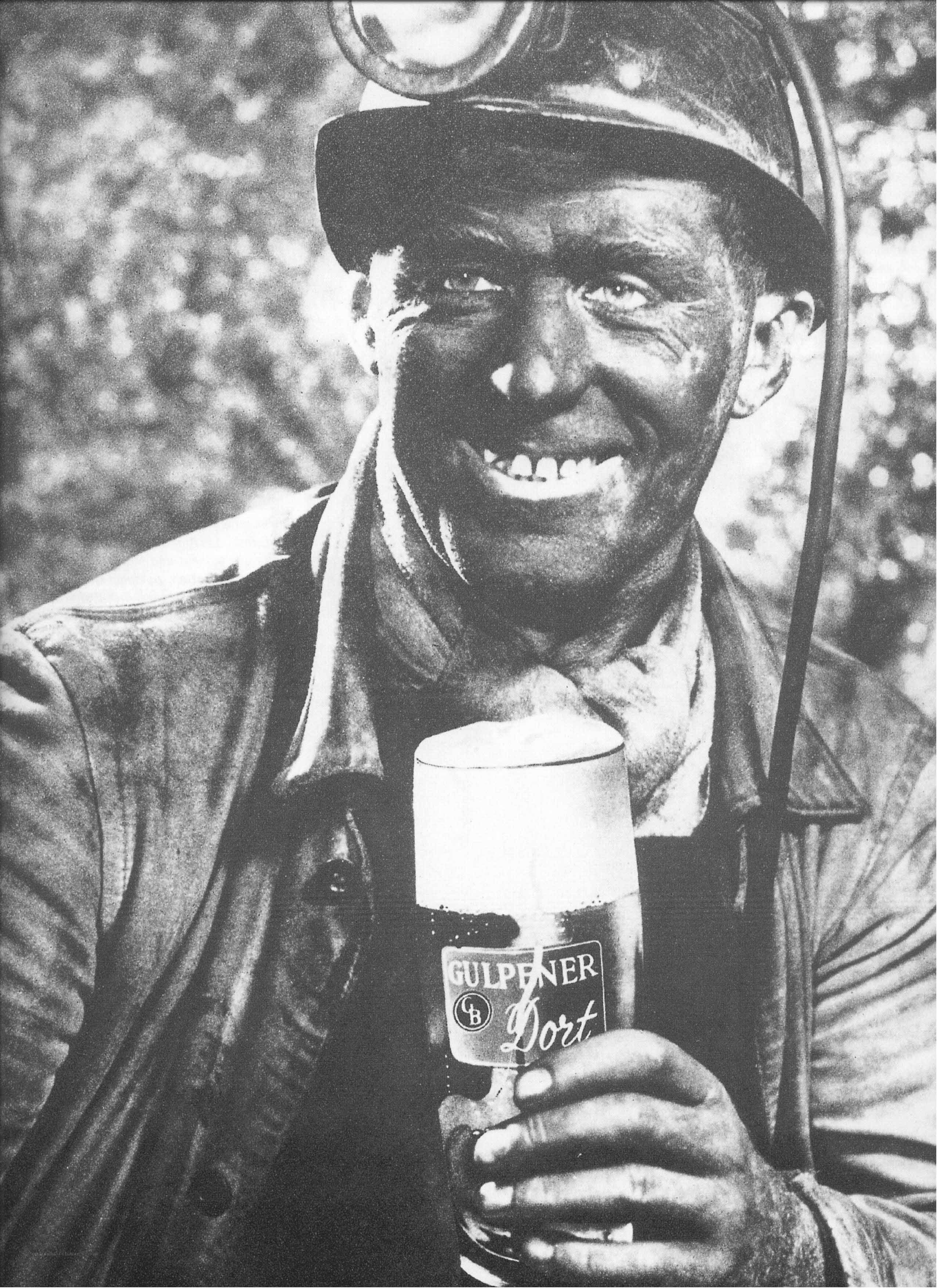 miner holding beer glass