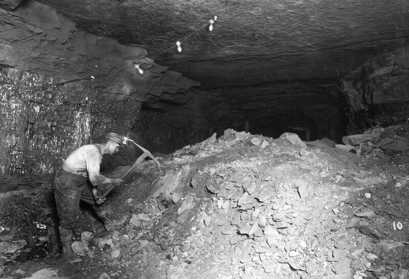 miner working in underground tunnel