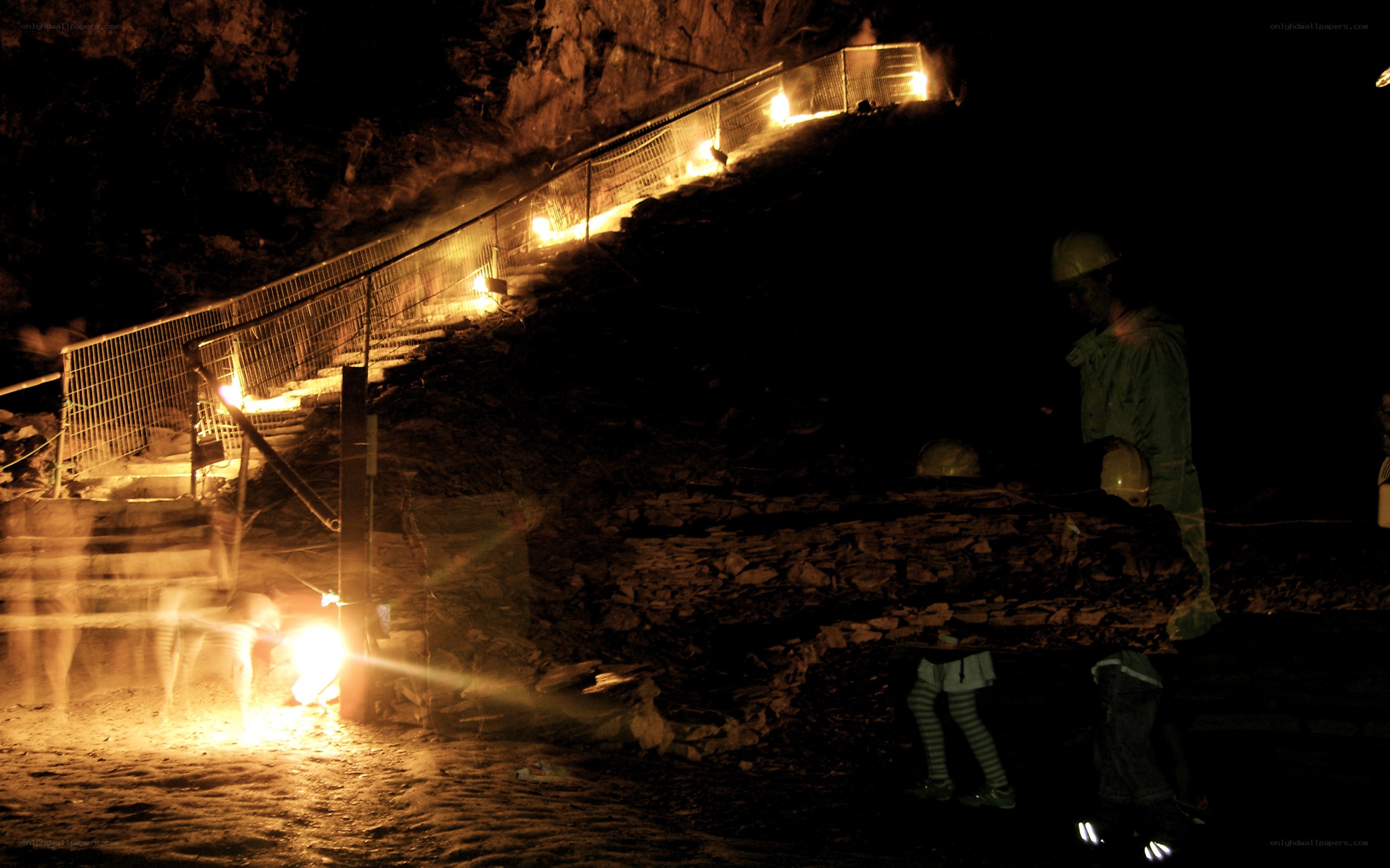 Miners in a dark tunnel