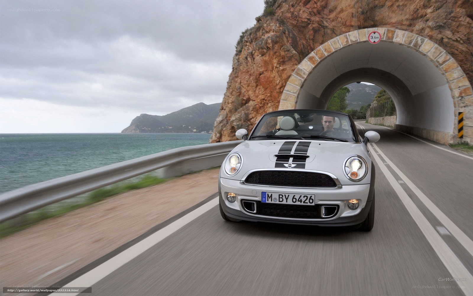 Mini Cooper driving on coastal road