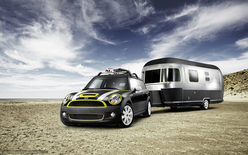 Mini Cooper towing trailer on beach
