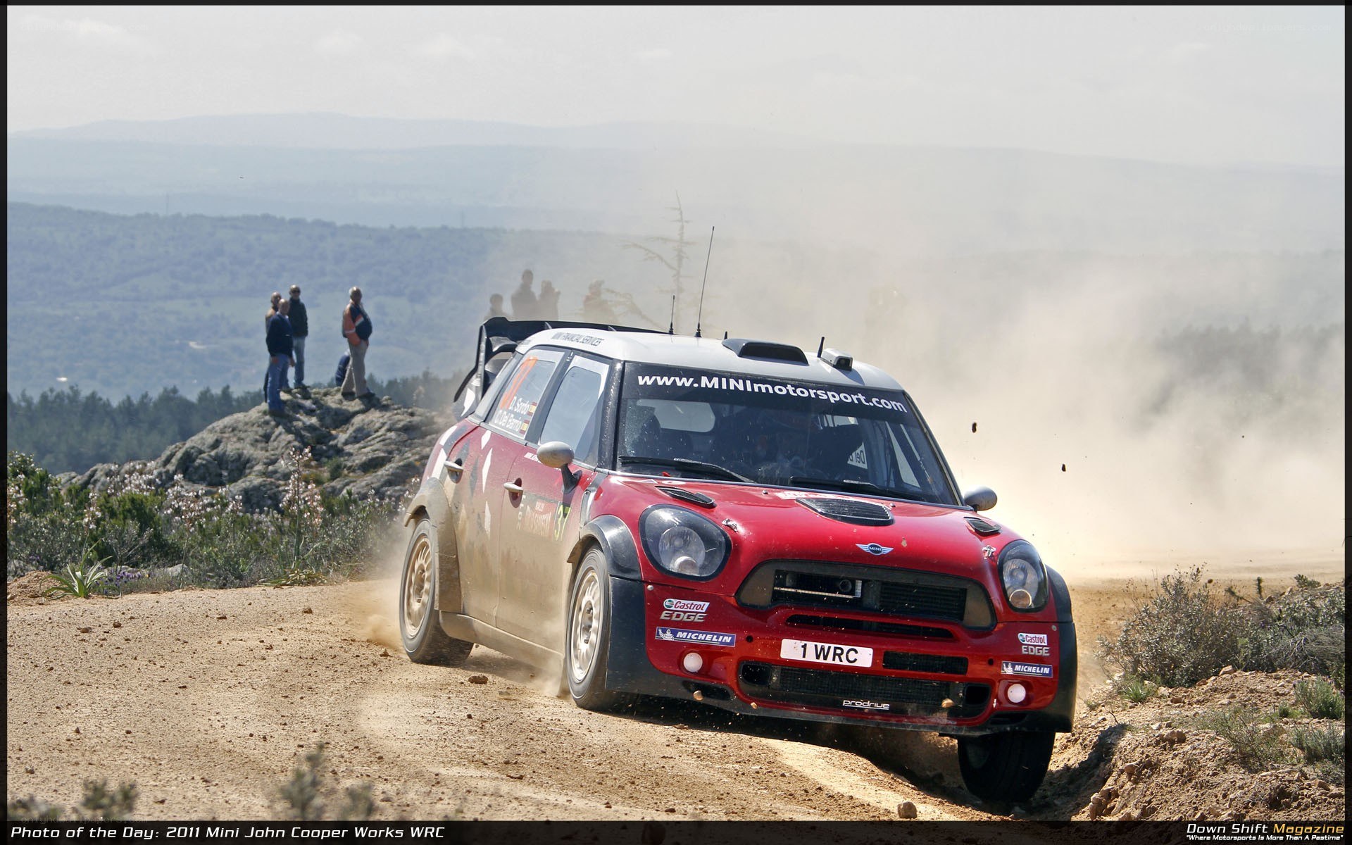 Mini rally car on dirt road