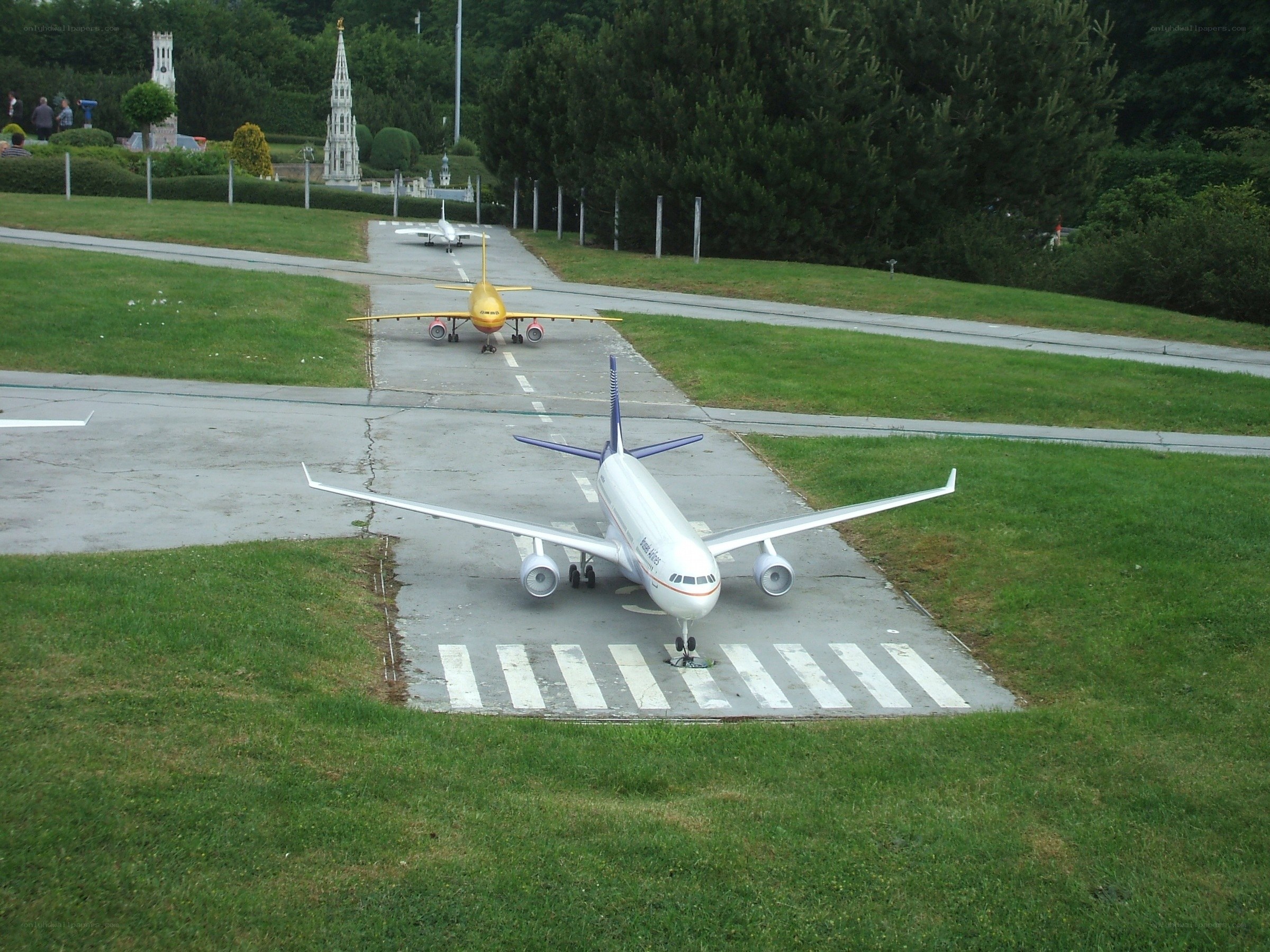 Miniature airplanes on a runway