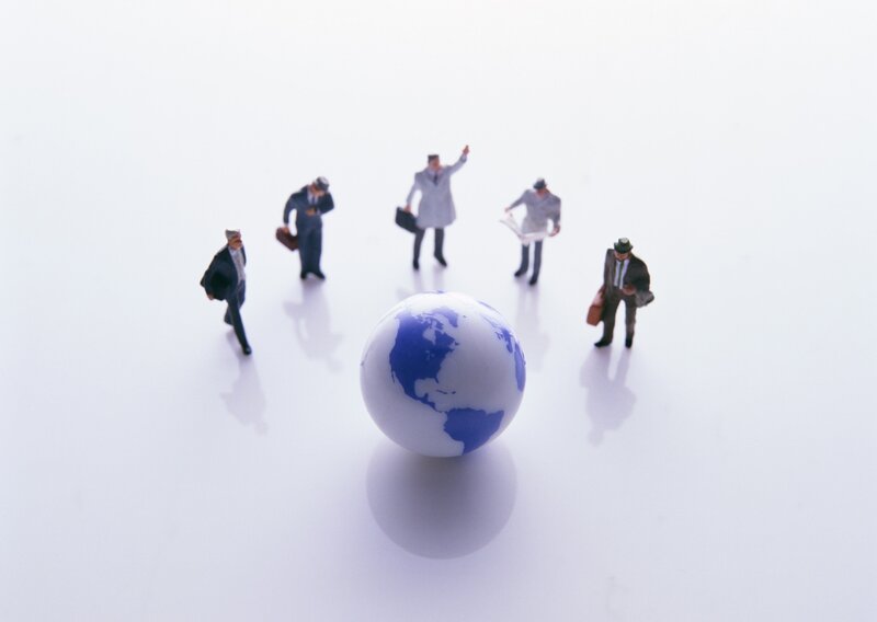 Miniature Businessmen Around Globe
