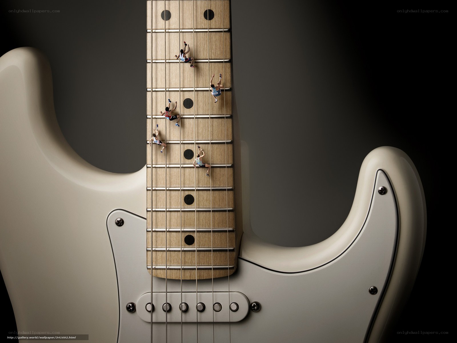 Miniature climbers on guitar neck