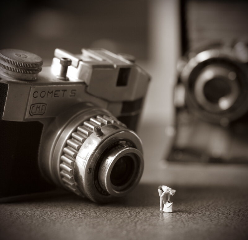 Miniature figure with vintage camera