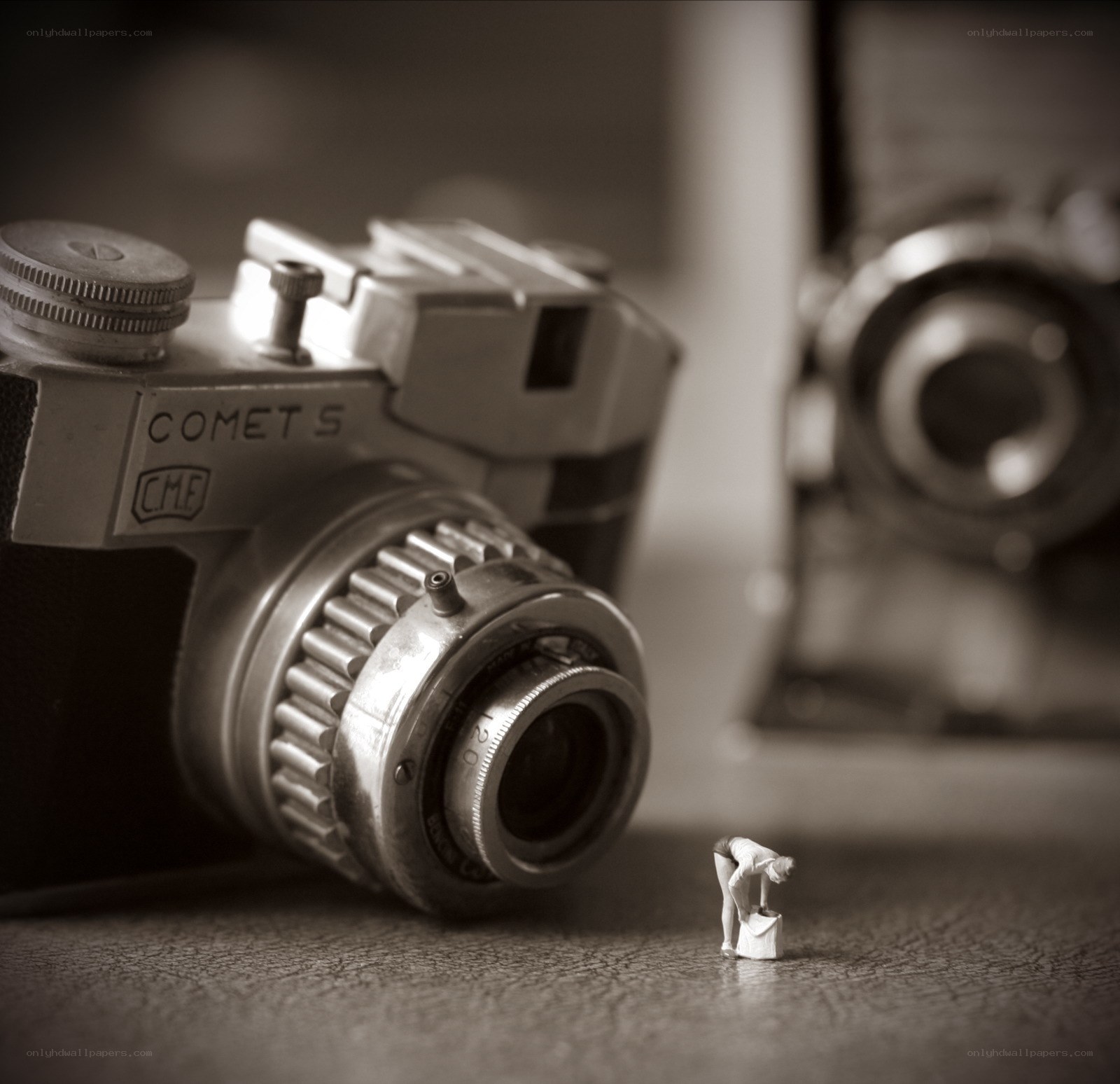 Miniature figure with vintage camera