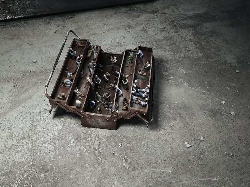 Miniature figures in a toolbox