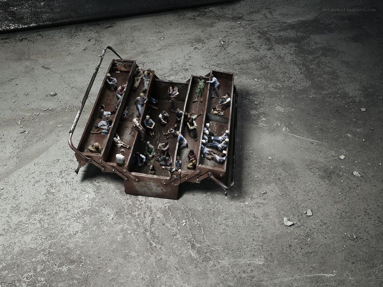 Miniature figures in a toolbox
