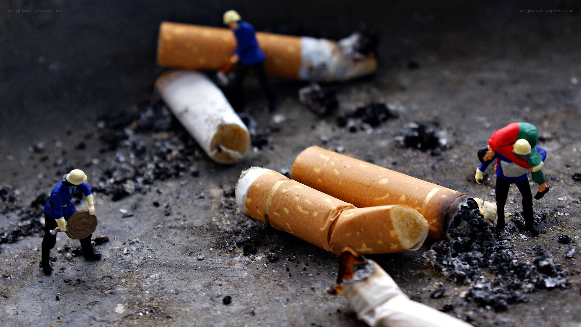 Miniature figures on cigarette debris
