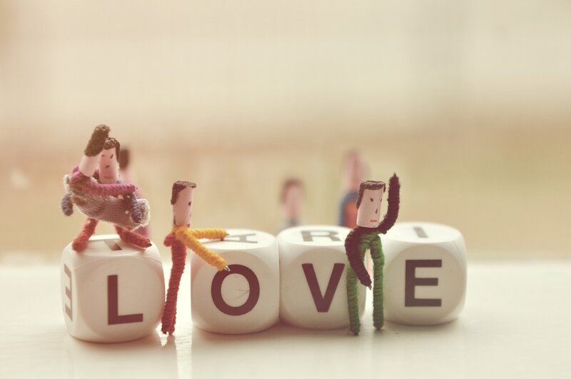 Miniature figures on love blocks