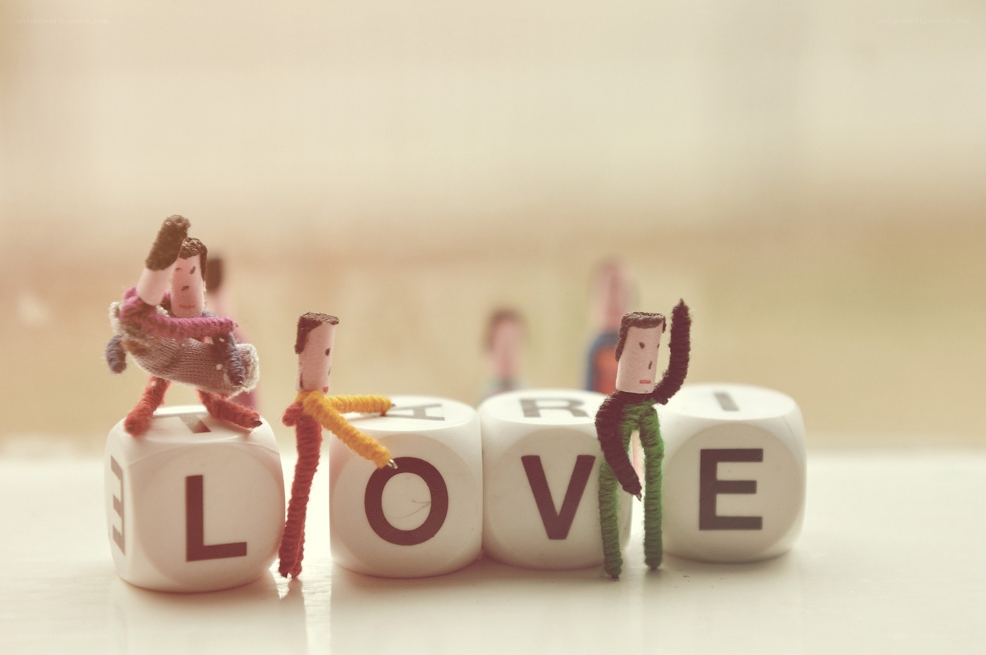 Miniature figures on love blocks