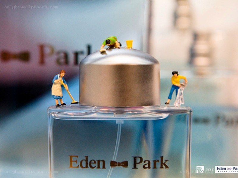 Miniature figures on perfume bottle