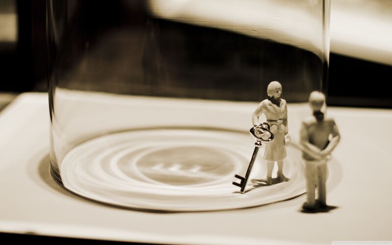 Miniature figures under glass dome
