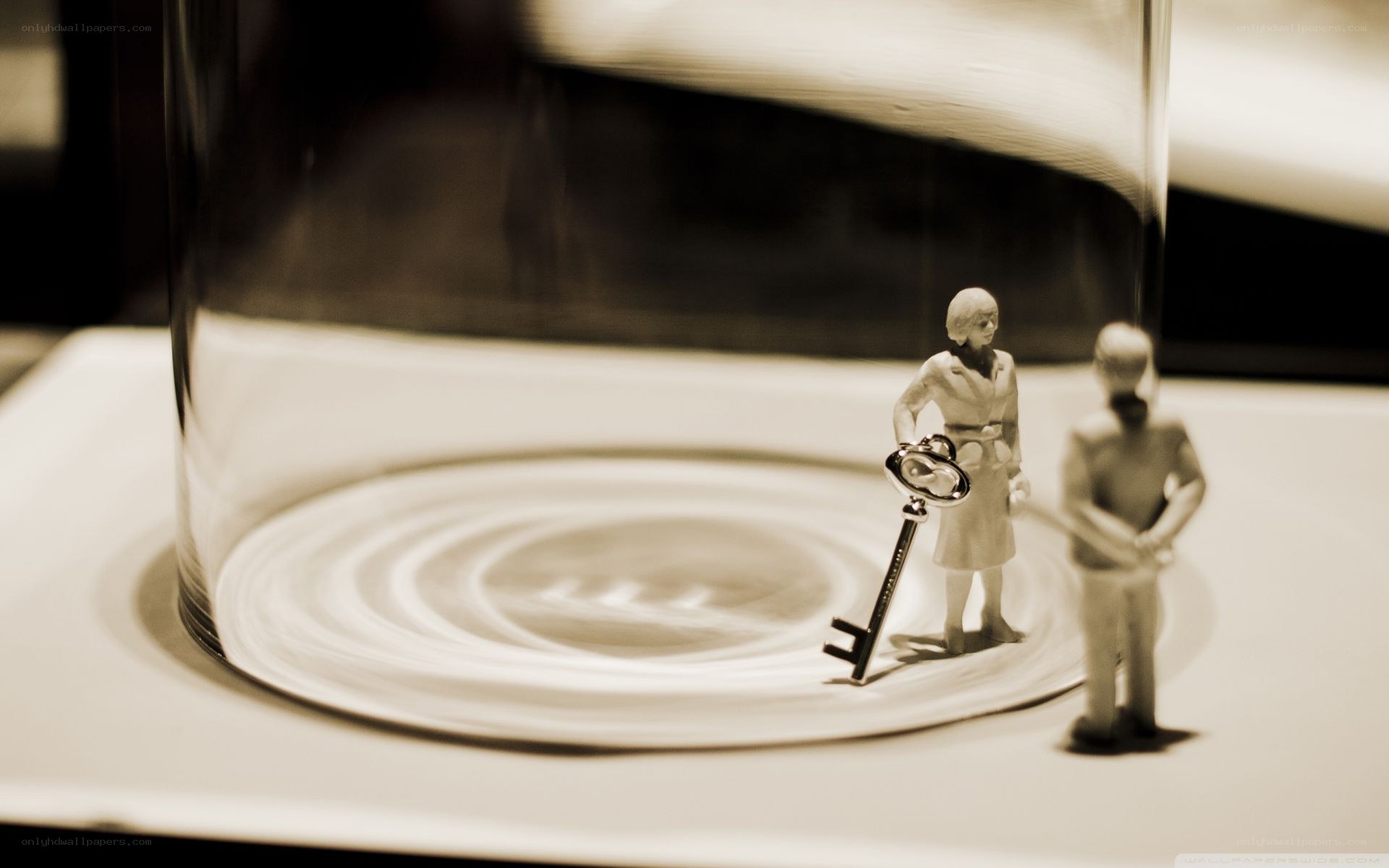 Miniature figures under glass dome
