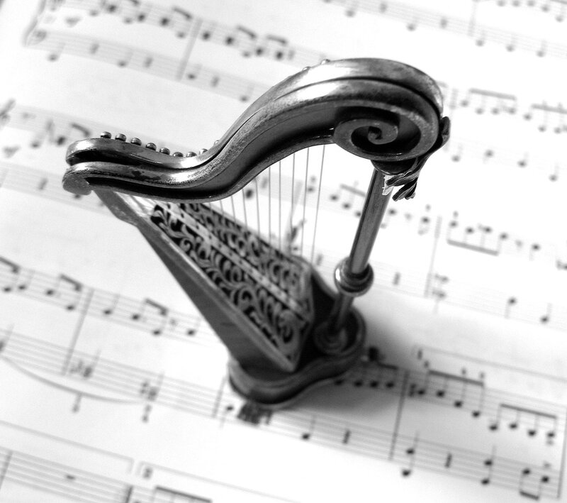 Miniature Harp on Sheet Music