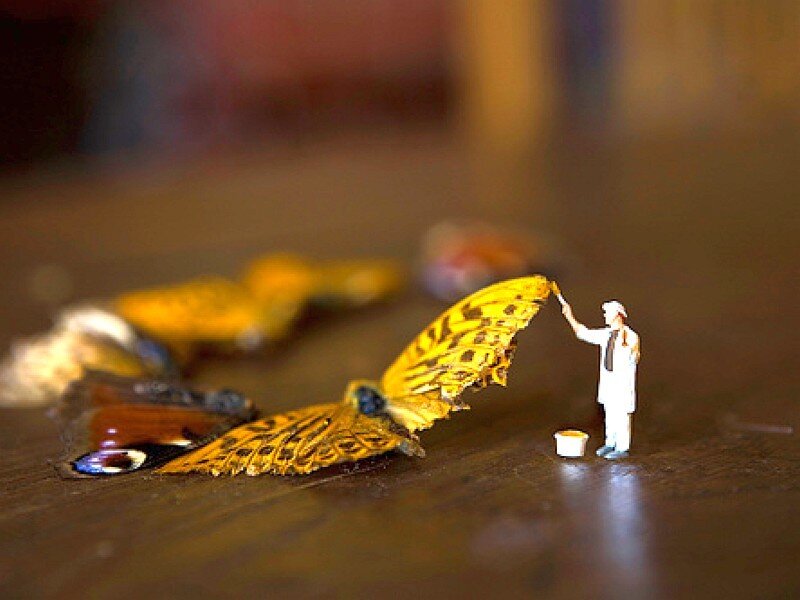 Miniature painter with butterfly