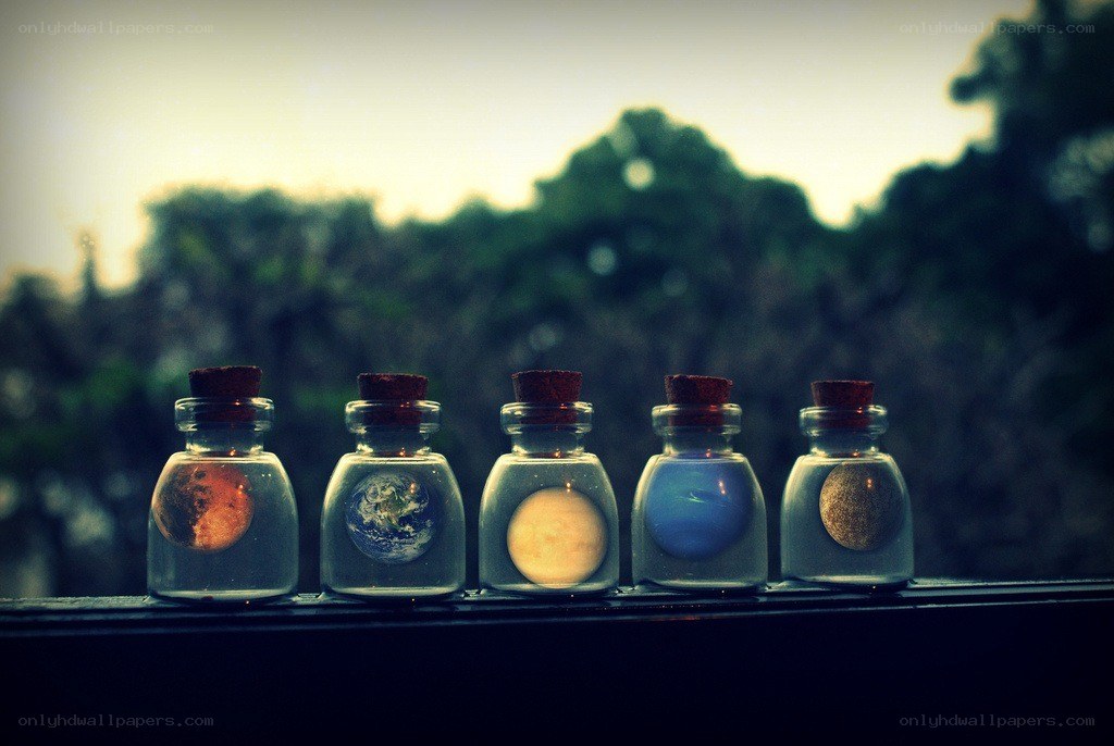 Miniature planets in glass bottles