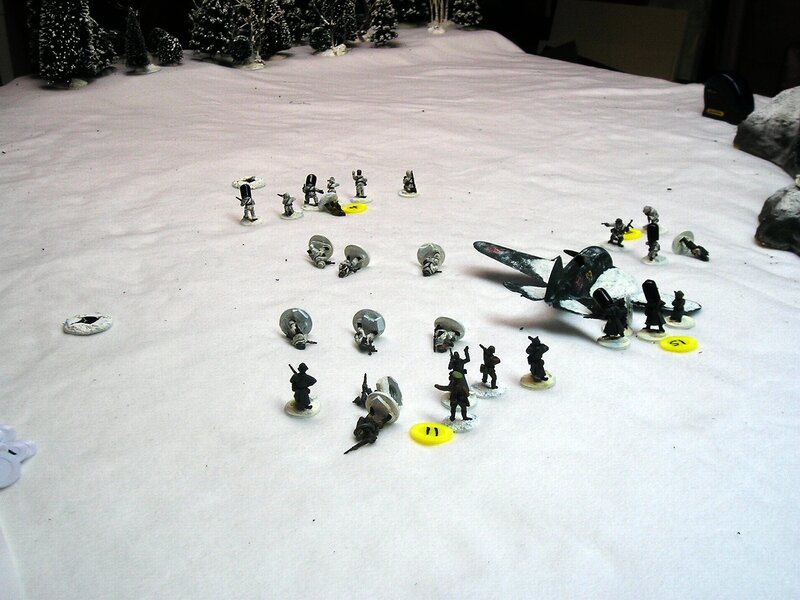 Miniature wargame in snowy terrain