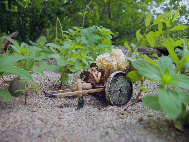 Miniature woman on cart