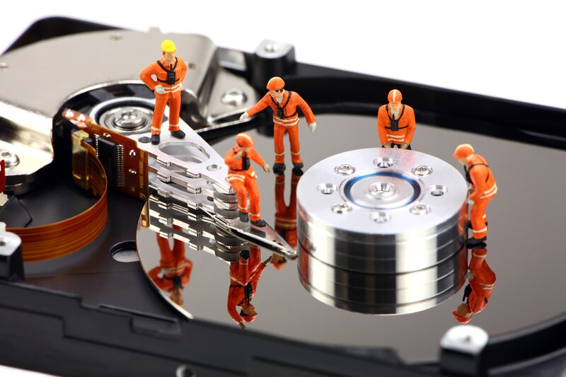 Miniature Workers on Hard Drive