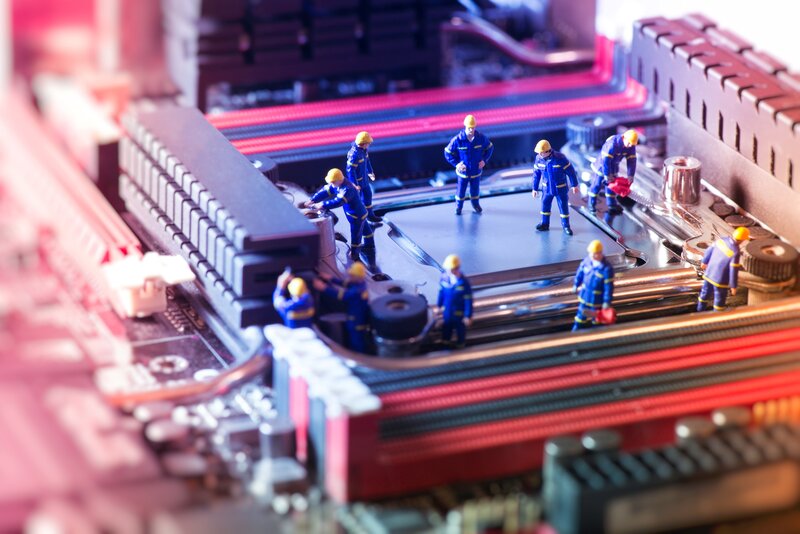 Miniature Workers on Motherboard — Blue, Dramatic, Photograph