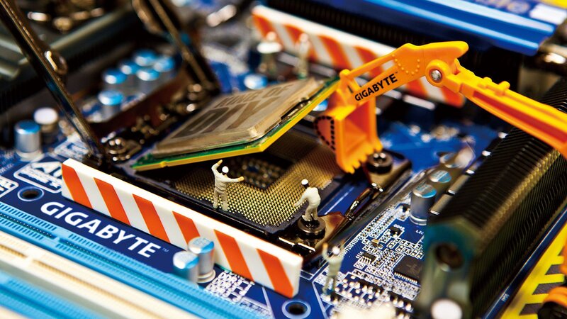 Miniature Workers on Motherboard — Blue