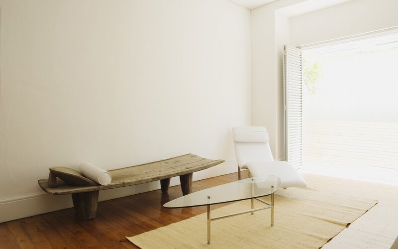 Minimalist living room with wooden bench