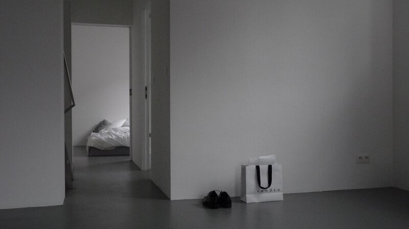 Minimalist room with shopping bag