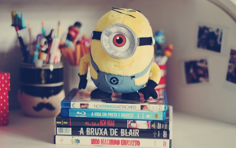 Minion plush on DVD stack