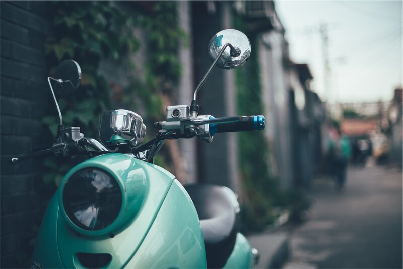 mint scooter in alleyway