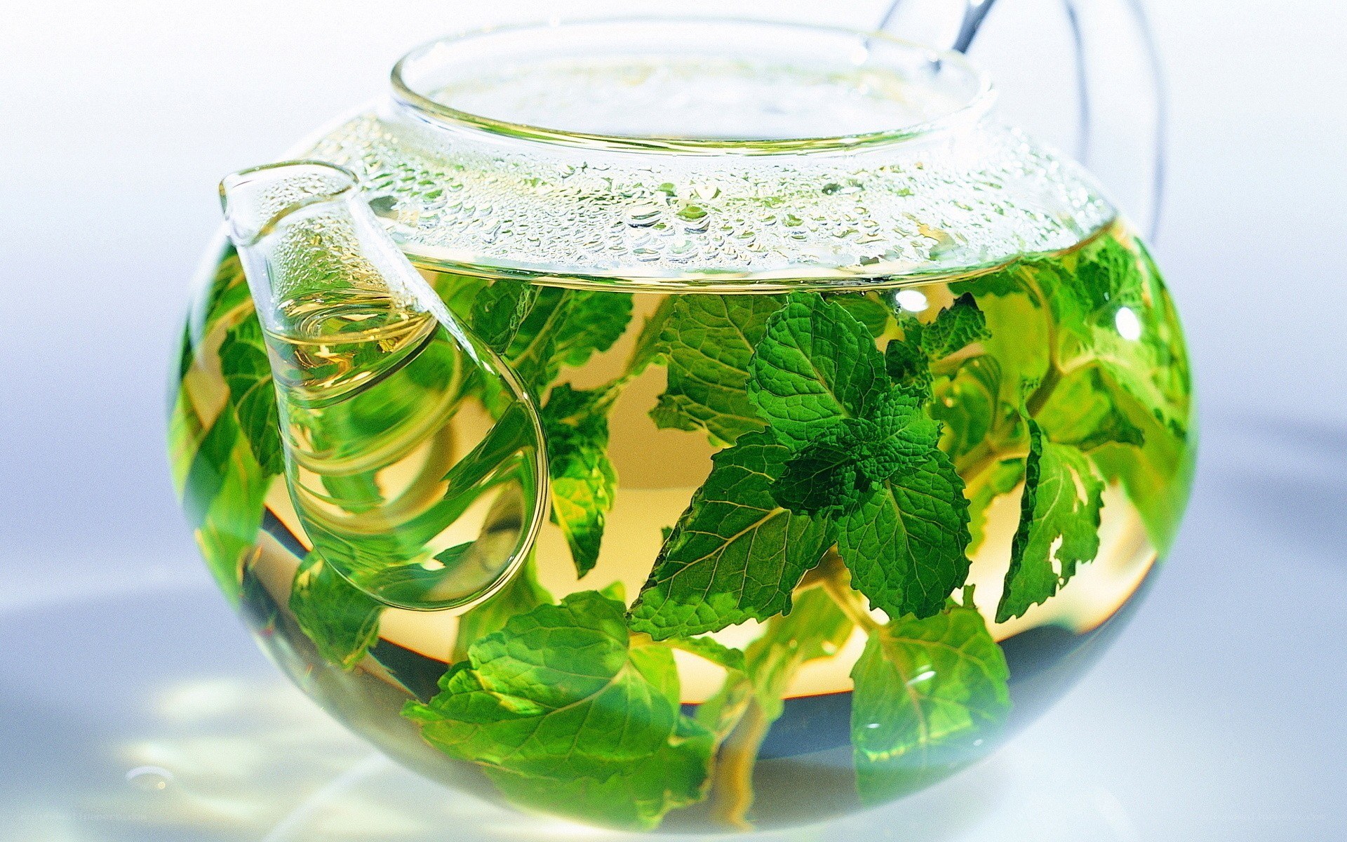 mint tea in glass teapot