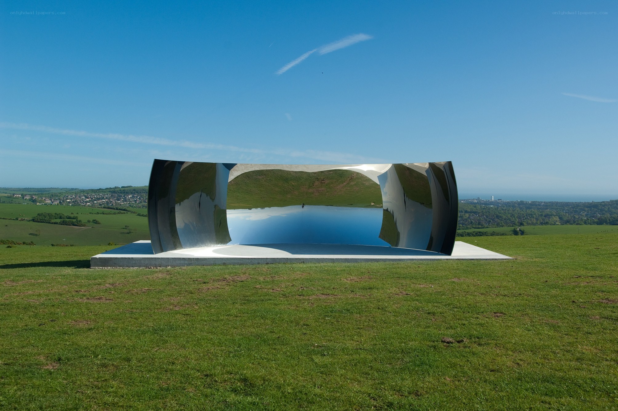Mirror sculpture in a field