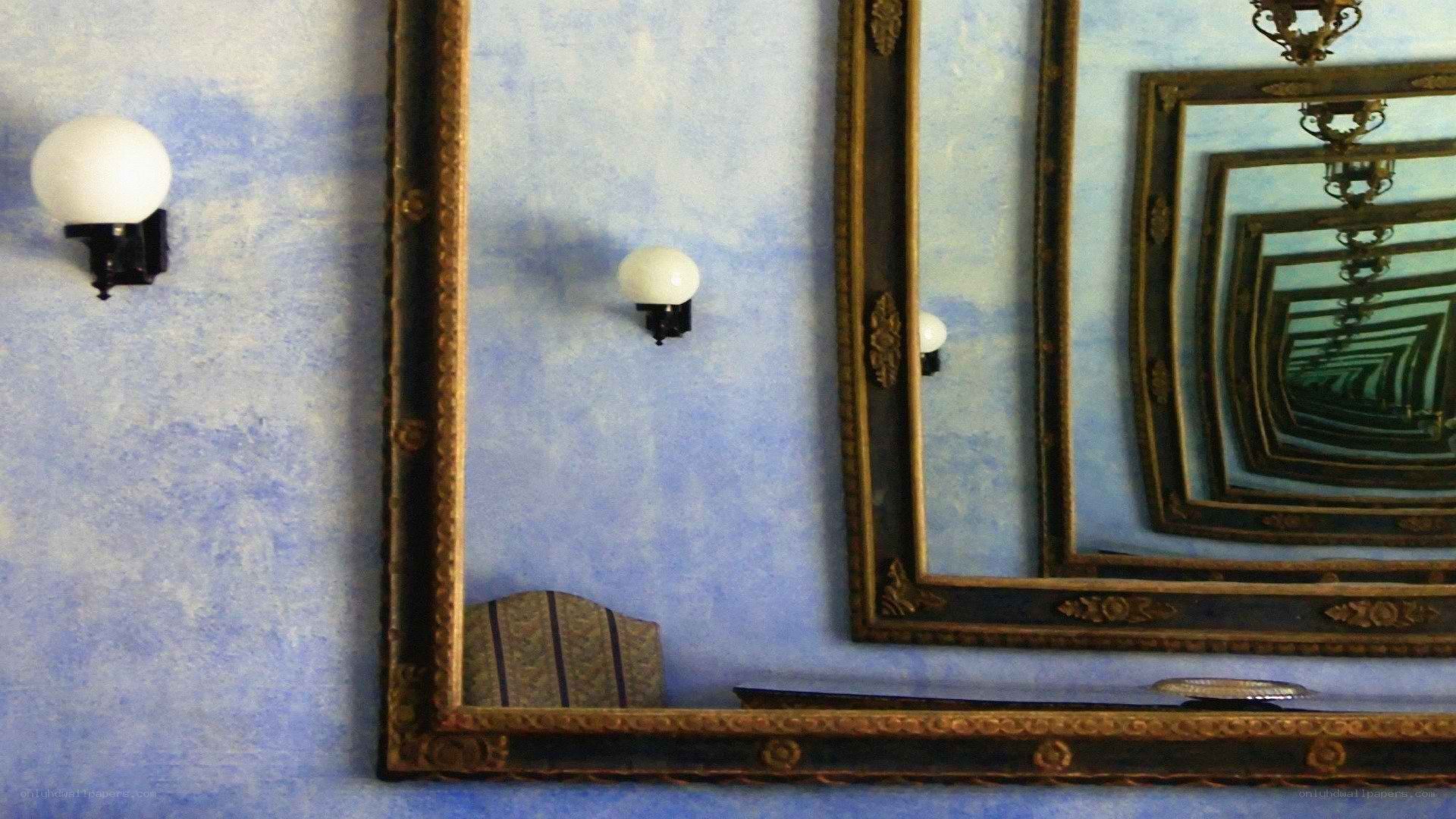 Mirrors in a blue room