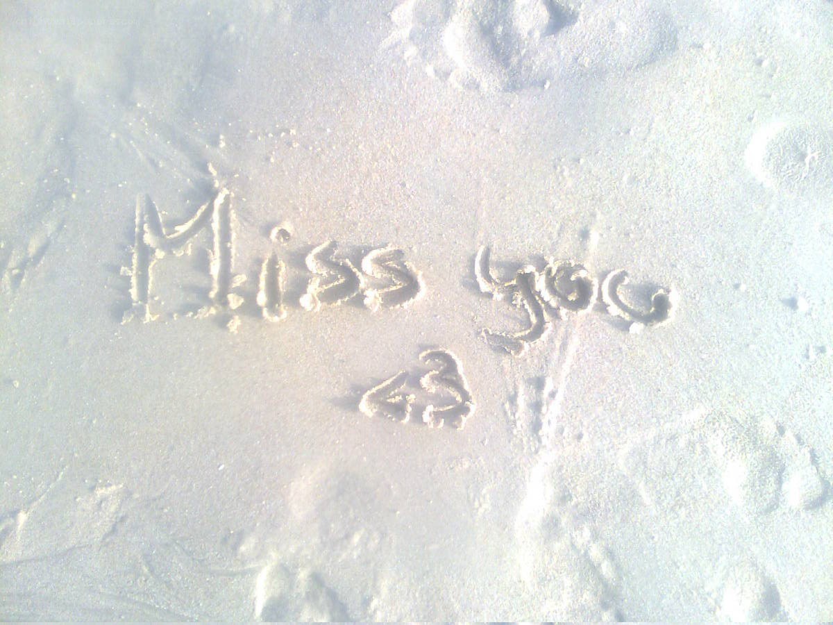 Miss you written in the sand
