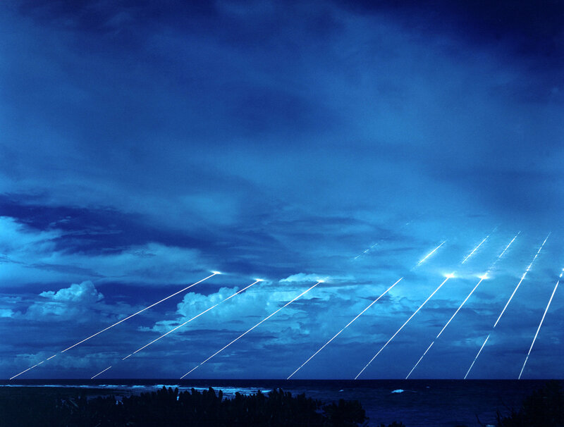Missiles launching over ocean