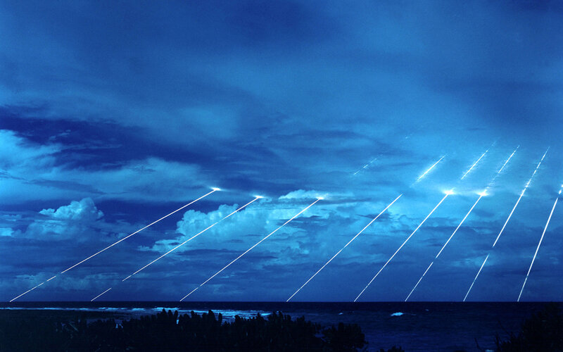 Missiles launching over ocean