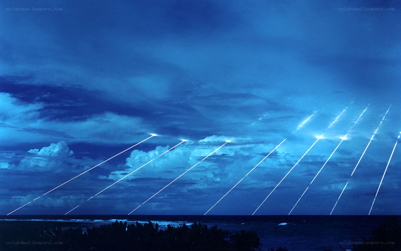 Missiles launching over ocean