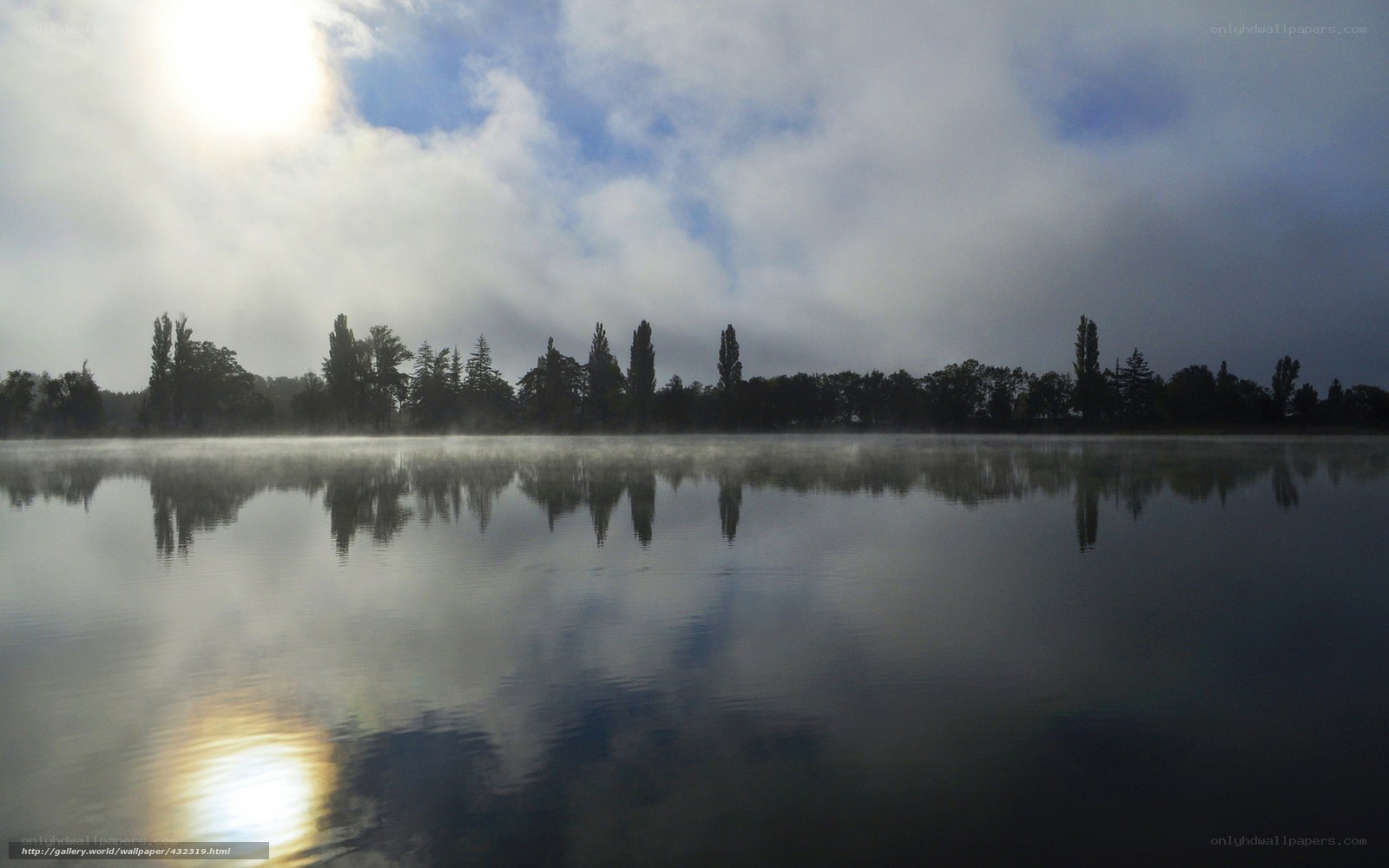 Mist over a calm lake