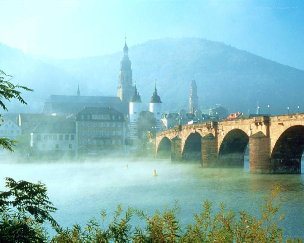 Mist over a historic river town